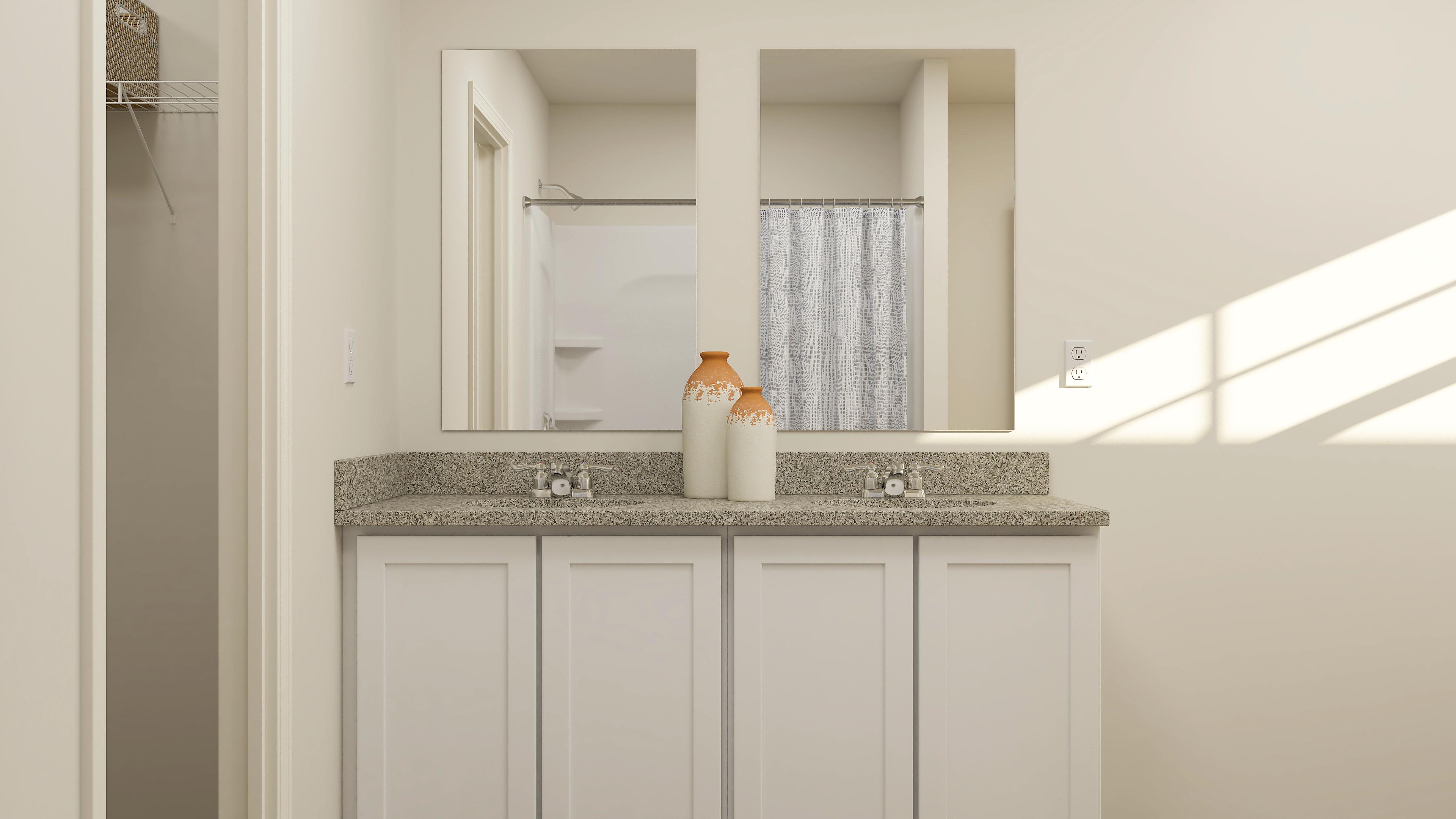 A bathroom with a marble countertop.