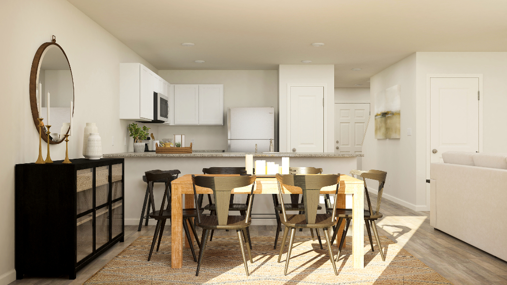 A kitchen with a dining table.