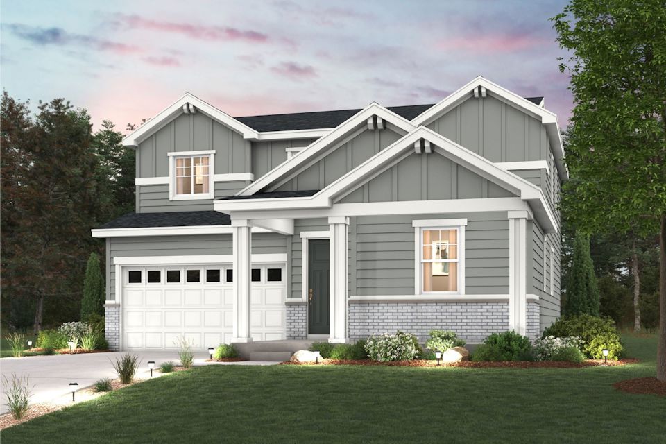 A house with a lawn in front of it.